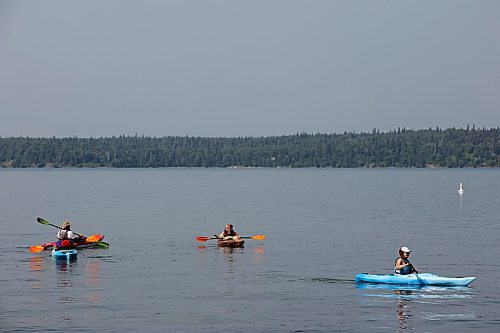 03082023
Kayakers paddle through the cool water of Clear Lake in Riding Mountain National Park on a hot Thursday. 
(Tim Smith/The Brandon Sun)