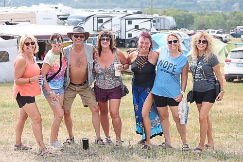 Some Rockin’ the Fields of Minnedosa attendees pose for a quick group photo before heading over to the festival stage area on Friday afternoon. (Kyle Darbyson/The Brandon Sun)