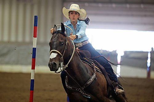 04082023
Breanna Linders weaves through poles atop her horse during the High School Pole Bending event at the Canadian High School Finals Rodeo at the Keystone Centre in Brandon on Friday. The rodeo continues today. (Tim Smith/The Brandon Sun)