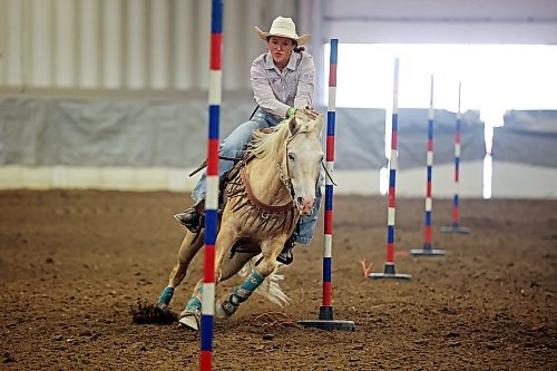 04082023
Andee Cowan of Manitoba weaves through poles atop her horse during the High School Pole Bending event at the Canadian High School Finals Rodeo at the Keystone Centre in Brandon on Friday. The rodeo continues today. (Tim Smith/The Brandon Sun)
