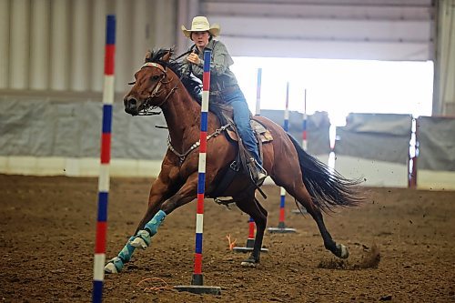 04082023
Brenna Johnston of Manitoba weaves through poles atop her horse during the High School Pole Bending event at the Canadian High School Finals Rodeo at the Keystone Centre in Brandon on Friday. The rodeo continues today. (Tim Smith/The Brandon Sun)