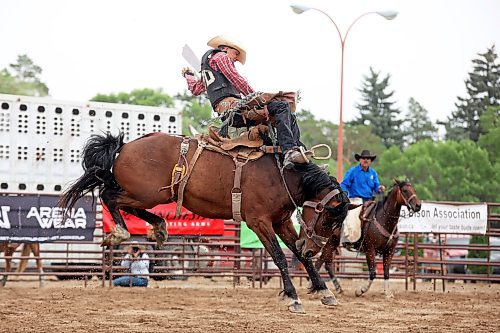 04082023
Calvin Webster tries to stay atop his horse during the High School Saddle Bronc Riding event at the Canadian High School Finals Rodeo at the Keystone Centre in Brandon on Friday. The rodeo continues today.
(Tim Smith/The Brandon Sun)