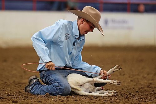 04082023
Wyatt Bremner ties the legs of a goat during the Junior High Boy&#x2019;s Goat Tying event at the Canadian High School Finals Rodeo at the Keystone Centre in Brandon on Friday. The rodeo continues today. (Tim Smith/The Brandon Sun)