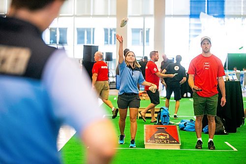 MIKAELA MACKENZIE / WINNIPEG FREE PRESS

Lisa-Marie Walz (left, German police) and Jesse Billiaert (Brandon fire and emergency services) compete in cornhole at the World Police and Fire Games at the RBC Convention Centre on Friday, Aug. 4, 2023. For &#x460;story.
Winnipeg Free Press 2023