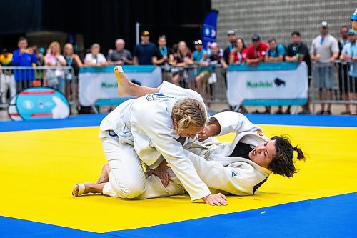 MIKAELA MACKENZIE / WINNIPEG FREE PRESS

Rianne Vanderburg (top, Calgary police) and Han I Pin (Taiwanese police) compete in jiu jitsu at the World Police and Fire Games at the RBC Convention Centre on Friday, Aug. 4, 2023. For &#x460;story.
Winnipeg Free Press 2023