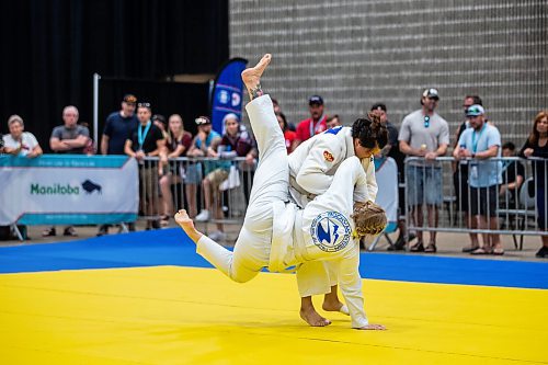 MIKAELA MACKENZIE / WINNIPEG FREE PRESS

Han I Pin (top, Taiwanese police) and Rianne Vanderburg (Calgary police) compete in jiu jitsu at the World Police and Fire Games at the RBC Convention Centre on Friday, Aug. 4, 2023. For &#x460;story.
Winnipeg Free Press 2023