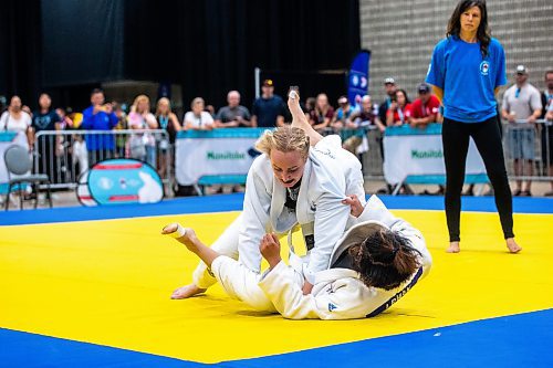 MIKAELA MACKENZIE / WINNIPEG FREE PRESS

Rianne Vanderburg (top, Calgary police) and Han I Pin (Taiwanese police) compete in jiu jitsu at the World Police and Fire Games at the RBC Convention Centre on Friday, Aug. 4, 2023. For &#x460;story.
Winnipeg Free Press 2023