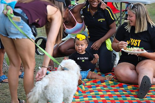 Eleven-month-old Mila Brown enjoys the company of family and friends during local Jamaica Independence Day festivities that took place at Rideau Park over the weekend. (Kyle Darbyson/The Brandon Sun)