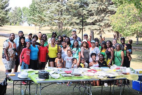 Members of Brandon’s Jamaican community pose for a group photo at Rideau Park on Sunday. These local residents gathered in the city’s east end on Sunday to celebrate their home country gaining independence from the United Kingdom on Aug. 6, 1962. (Kyle Darbyson/The Brandon Sun)