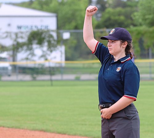 Umpire Akayla Veysey, shown signalling an out, is studying to become a teacher. (Perry Bergson/The Brandon Sun)
Aug. 10, 2023