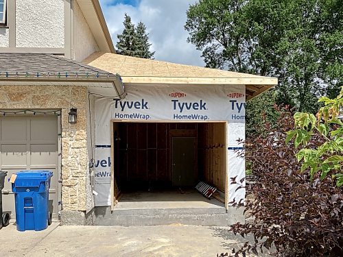 Photos by Marc LaBossiere / Winnipeg Free Press
A third garage stall is added to the existing double attached garage of a home in Charleswood. 