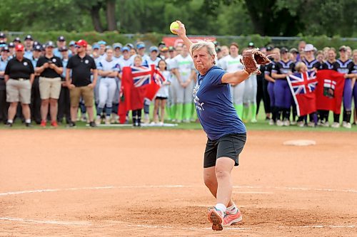 Bev Neufeld, host committee co-chair, Westman Magic assistant coach and mother of Ashley Neufeld, throws out the ceremonial first pitch during the opening ceremony of the U15 Girl's Canadian Fast Pitch Championships at the Ashley Neufeld Softball Complex in Brandon on Wednesday. Ashley Neufeld and two Dickinson State University softball teammates, Kyrstin Gemar and Afton Williamson, died in November 2009 when the vehicle they were in drove into a pond near the university in North Dakota. More photos from the ceremony on A4, and more coverage of the championships in today's sports section. (Tim Smith/The Brandon Sun)