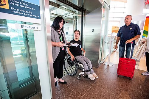 MIKAELA MACKENZIE / WINNIPEG FREE PRESS

Christina Redmond, director of terminal operations with the Winnipeg Airport Authority, guides Luke Armbruster, administrative assistant with Inclusion Winnipeg, through accessible elevators during a passenger rehearsal program tour at the Winnipeg Richardson International Airport on Tuesday, Aug. 8, 2023. With this program, travelers with disabilities are invited to check out the security and boarding process before they fly. For Eva Wasney story.
Winnipeg Free Press 2023