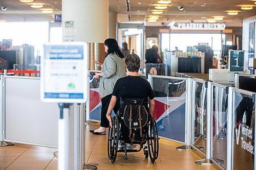 MIKAELA MACKENZIE / WINNIPEG FREE PRESS

Christina Redmond, director of terminal operations with the Winnipeg Airport Authority, takes Luke Armbruster, administrative assistant with Inclusion Winnipeg, through the beginning of security during a passenger rehearsal program tour at the Winnipeg Richardson International Airport on Tuesday, Aug. 8, 2023. With this program, travelers with disabilities are invited to check out the security and boarding process before they fly. For Eva Wasney story.
Winnipeg Free Press 2023