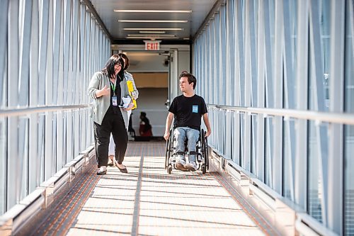 MIKAELA MACKENZIE / WINNIPEG FREE PRESS

Christina Redmond, director of terminal operations with the Winnipeg Airport Authority, shows Luke Armbruster, administrative assistant with Inclusion Winnipeg, the passenger boarding bridge during a passenger rehearsal program tour at the Winnipeg Richardson International Airport on Tuesday, Aug. 8, 2023. With this program, travelers with disabilities are invited to check out the security and boarding process before they fly. For Eva Wasney story.
Winnipeg Free Press 2023