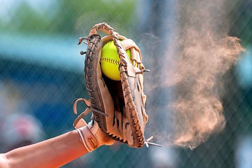 09082023
Catcher Kaylee Rank #15 of the Westman Magic catches the ball causing dust to billow from her mitt during a match against the Cloverdale Fury at the U15 Girl's Canadian Fast Pitch Championships at the Ashley Neufeld Softball Complex on Wednesday.
(Tim Smith/The Brandon Sun)