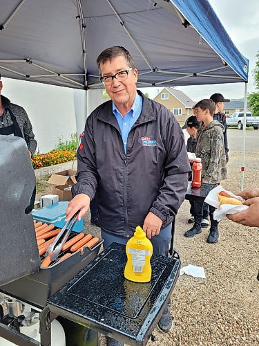 Member of Parliament for Dauphin-Swan River-Neepawa Dan Mazier barbecued up some hotdogs and chatted with his constituents at his community gathering and popup passport service at the Minnedosa Legion #138 on Aug. 10. (Miranda Leybourne/The Brandon Sun)
