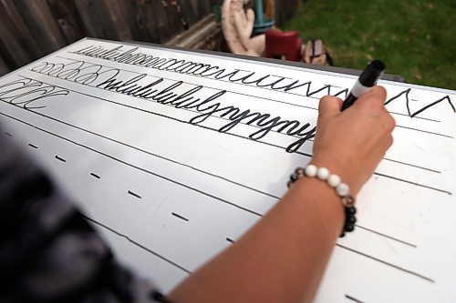 RUTH BONNEVILLE / WINNIPEG FREE PRESS

Local - Cursive controversy

Shelley Drewniak, a grade 5/6 Teacher, uses a white board to show styles of  cursive writing at her home.

See Maggie's story.


August 10th,  2023

