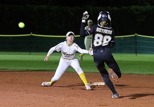 Westman Magic shortstop Mya Duncan-Gagnon watches a throw go well wide of second base as Waterloo Ghosts base runner Lindsay Sothern arrives safely during Waterloo&#x2019;s 12-0 win under the Ashley Neufeld Softball Complex lights late Thursday evening at Softball Canada&#x2019;s under-15 girls national championship. (Perry Bergson/The Brandon Sun)
Aug. 11, 2023
