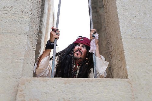 RUTH BONNEVILLE / WINNIPEG FREE PRESS

INTERSECTION - Jack of Wpg

Photos of Todd Douglas, AKA Jack Sparrow, at various iconic spots in Winnipeg including, St-Boniface Cathedral, on the Red River with Esplanade Bridge, at the Forks and next to the Splash Dash boat at the Forks.  

His partner, Corinne Bremner, AKA Mrs. Scarlet, also in one of the photos. 

What: This is for an Intersection piece on Todd's alter-ego, Jack in the Peg. For close to a decade, Douglas, an actor, has hit the town as the Jack Sparrow character from the Pirates of the Caribbean movies. It started off as a Halloween lark, he now gets paid to show up as Jack for b-day parties, work events, restaurant launches, etc.

See Dave Sanderson's story

August 9th,  2023

