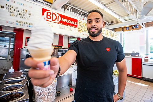 MIKAELA MACKENZIE / WINNIPEG FREE PRESS

BDI owner Justin Jacob serves up a cone of lupin-bean frozen dessert on Thursday, Aug. 10, 2023. This may be the first of its kind in Canada, and is made at the University of Manitoba. For Gabby story.
Winnipeg Free Press 2023.