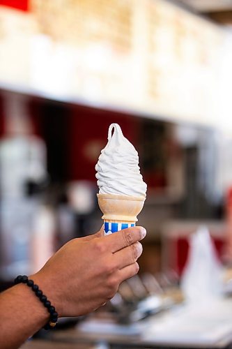 MIKAELA MACKENZIE / WINNIPEG FREE PRESS

BDI owner Justin Jacob serves up a cone of lupin-bean frozen dessert on Thursday, Aug. 10, 2023. This may be the first of its kind in Canada, and is made at the University of Manitoba. For Gabby story.
Winnipeg Free Press 2023.