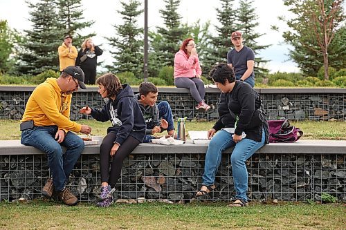 11082023
Reid Philp, Makeiko Philp, Tai Philp and Tracy Philp enjoy food during RibFest at the Riverbank Discovery Centre on Friday evening.
(Tim Smith/The Brandon Sun)