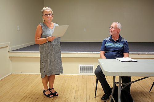 Quentin Robinson (right) listens as long-time friend Debbie Dandy (left) delivers remarks in support of his candidacy at the Manitoba NDP's nomination meeting for Brandon West on Saturday at the West End Community Centre. Robinson was acclaimed as candidate. (Colin Slark/The Brandon Sun)