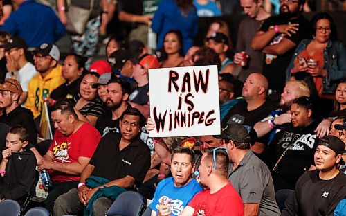 JOHN WOODS / WINNIPEG FREE PRESS
people hold signs at WWE in Winnipeg, Monday, August 14, 2023. 

Reporter: mcintyre