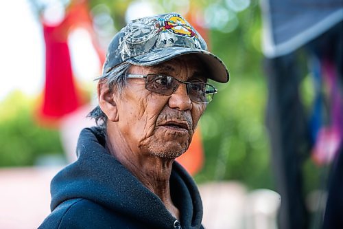 MIKAELA MACKENZIE / WINNIPEG FREE PRESS

Camp elder Marcel Branch boils water on the grill for coffee at Camp Marcedes (beside the Canadian Museum for Human Rights) on Monday, Aug. 14, 2023. For Cierra Bettens story.
Winnipeg Free Press 2023