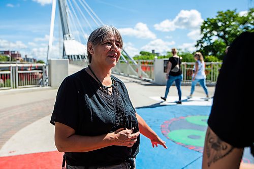 MIKAELA MACKENZIE / WINNIPEG FREE PRESS

Daniella Peltier by a new mural painted at Camp Marcedes (beside the Canadian Museum for Human Rights) on Monday, Aug. 14, 2023. For Cierra Bettens story.
Winnipeg Free Press 2023