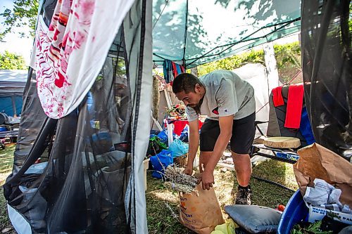 MIKAELA MACKENZIE / WINNIPEG FREE PRESS

Firekeeper Shining Goldstar shows medicinal cedar, sage, and juniper at Camp Marcedes (beside the Canadian Museum for Human Rights) on Monday, Aug. 14, 2023. For Cierra Bettens story.
Winnipeg Free Press 2023