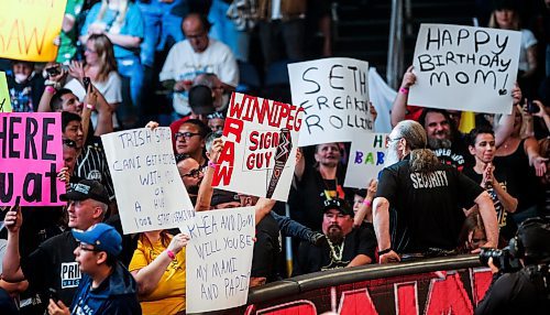 JOHN WOODS / WINNIPEG FREE PRESS
people hold signs at WWE in Winnipeg, Monday, August 14, 2023. 

Reporter: mcintyre