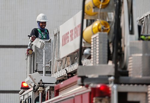 JOHN WOODS / WINNIPEG FREE PRESS
Mariam Wancha, who came from Ethiopia in 2019, gets on a ladder truck at the Winnipeg Fire Paramedic Service (WFPS) training academy in Winnipeg, Tuesday, August 15, 2023. The WFPS hosted 36 newcomer youth at a two-day skills training career camp.

Reporter: cierra