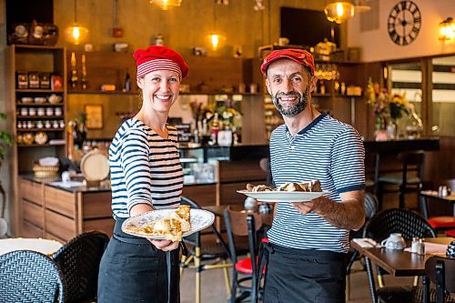 MIKAELA MACKENZIE / WINNIPEG FREE PRESS

Ketty Pichaud (left) and Yvonnick Le Lorec, owners, pose for a photo at the newly opened Ker Breizh Crperie on Sherbrooke in Winnipeg on Tuesday, July 19, 2022. For Eva Wasney story.
Winnipeg Free Press 2022.