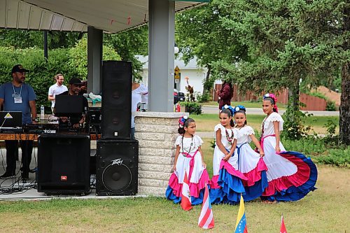 Honduran dancers wait for their cue to start their performance at the First HAMI Hispanic Festival at Rideau Park on Saturday. (Colin Slark/The Brandon Sun)