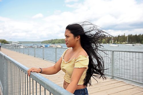 16082023
The strong wind blows through the hair of Sofia Asejo on her fourteenth birthday while she looks out from the pier at the Clear Lake Marina in Wasagaming during a family trip to Riding Mountain National Park on Wednesday. (Tim Smith/The Brandon Sun)