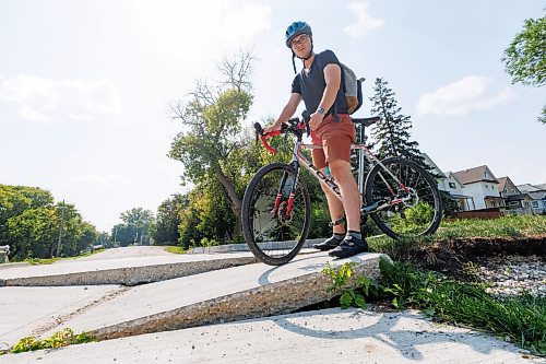 MIKE DEAL / WINNIPEG FREE PRESS
Evan Krosney commutes with his bike everyday and has to contend with this dangerous part of the bike path that joins up with Hallet Street in Point Douglas.
See Joyanne Pursaga story
230817 - Thursday, August 17, 2023.