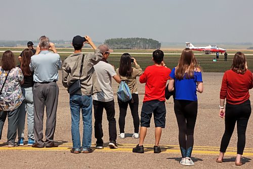 17082023
Aviation enthusiasts watch as the Canadian Forces Snowbirds prepare to depart during a stop at the Brandon Airport on Thursday afternoon. The Snowbirds stopped at the Brandon Flight Centre en route to Winnipeg to refuel and have lunch with BFC students and staff as well as Air Cadets in Brandon for the summer training at the Brandon Cadet Training Centre. They also put on a short airshow for those in attendance and Brandonites lucky enough to look up and catch a glimpse.  (Tim Smith/The Brandon Sun)