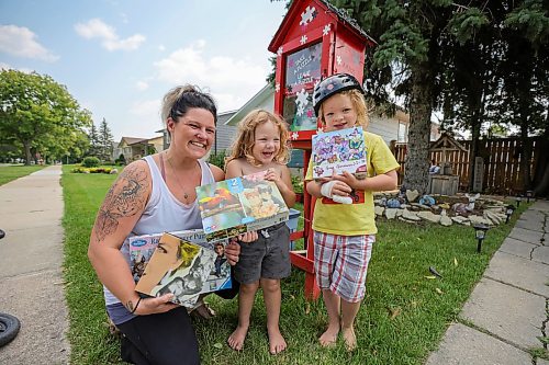 RUTH BONNEVILLE / WINNIPEG FREE PRESS

Local -  Puzzle swap 

Photo of Cori Toews with her two sons, Rowan (3yrs) and Harlan (5yrs), next to their little puzzle library in front of their home in St. Vital. 

STORY, LITTLE PUZZLE LIBRARY:  (the size of a tiny book library) that recently opened on Wales Avenue in St. Vital. 

Interviewed Cori Toews who has over 200 puzzles on shelves in her basement with 10-15 puzzles in the library nook outside her home. She says 3-6 people look through the puzzle library daily and it's given her an opportunity to connect with her neighbours. 

Story - TESSA, 

August 17th, 2023

