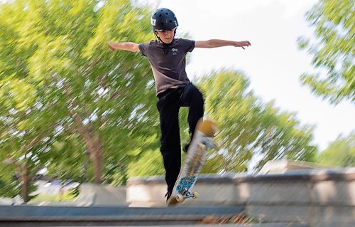 Mike Thiessen / Winnipeg Free Press 
Shane Garnham does an ollie down a set of two stairs in Sk8 Skates&#x2019; free skateboard lessons at the Plaza at the Forks. 230817 &#x2013; Thursday, August 17, 2023