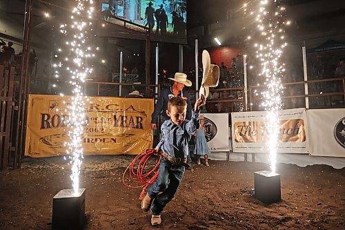 A young cowboy runs into the rodeo arena during the opening ceremonies at the Friday night go round of the Virden Indoor Rodeo at Tundra Oil & Gas Place. (Photos by Tim Smith/The Brandon Sun)