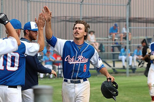 Ty Paddock of the Oak River Dodgers celebrates a home run to lead off the bottom of the seventh inning as his club rallied from a 7-3 deficit to win 8-7 over the South Delta Brewers at the Western Canadian senior AA baseball championship on Friday. (Photos by Perry Bergson/The Brandon Sun)
