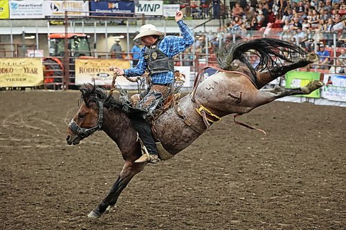18082023
A cowboy tries to stay in the saddle during the Saddle Bronc event at the Friday night go round of the Virden Indoor Rodeo at Tundra Oil &amp; Gas Place. (Tim Smith/The Brandon Sun)