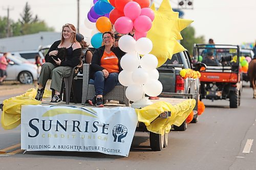 Members of Sunrise Credit Union enjoy the ride during Saturday’s Virden Indoor Rodeo and Wild West Daze parade. (Kyle Darbyson/The Brandon Sun)