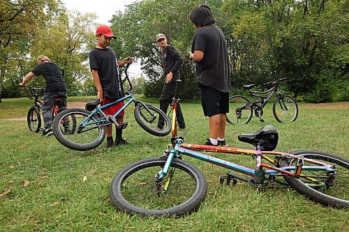 21082023
Friends Levi Wiebe, Ryan Houle, Nathan Wiebe and Chancellor Dyck Beardy hang out at the bike tracks on 3rd Street in Brandon&#x2019;s south end on Monday. 
(Tim Smith/The Brandon Sun)