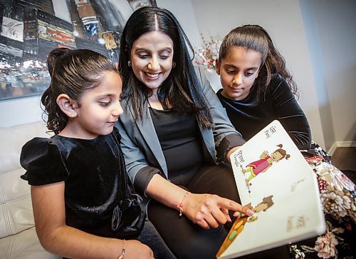 JOHN WOODS / WINNIPEG FREE PRESS
Jaspal Toor with her daughters Sureen, 8, and Sara, 4, read a punjabi language book together in their home in Winnipeg Tuesday, August  22, 2023. Sara will be attending a punjabi bilingual kindergarten class in September.

Reporter: macintosh