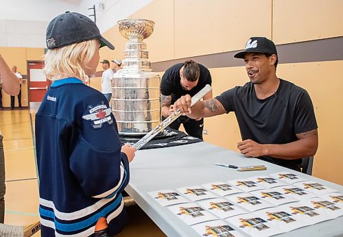 Mike Thiessen / Winnipeg Free Press 
The Vegas Golden Knights&#x2019; Keegan Kolesar returns a freshly signed hockey stick to a young fan at the Red River Community Centre during the Stanley Cup&#x2019;s stint in Manitoba. 230822 &#x2013; Tuesday, August 22, 2023