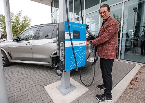 JOHN WOODS / WINNIPEG FREE PRESS
Stephen Chipman, President of the Birchwood Group, shows off their electric vehicle (EV) charger at their BMW dealership on Pembina in Winnipeg Tuesday, August  22, 2023. Birchwood is installing chargers at many of their dealerships.

Reporter: Cash