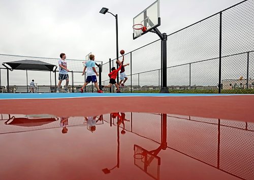 22082023
Friends Spencer Simpson, Jordan Nickel, Uan Lizada and Zach Nickel play basketball together at the Jumpstart Multi Sport Court on Maryland Avenue in Brandon&#x2019;s south end on a grey Tuesday. 
(Tim Smith/The Brandon Sun)